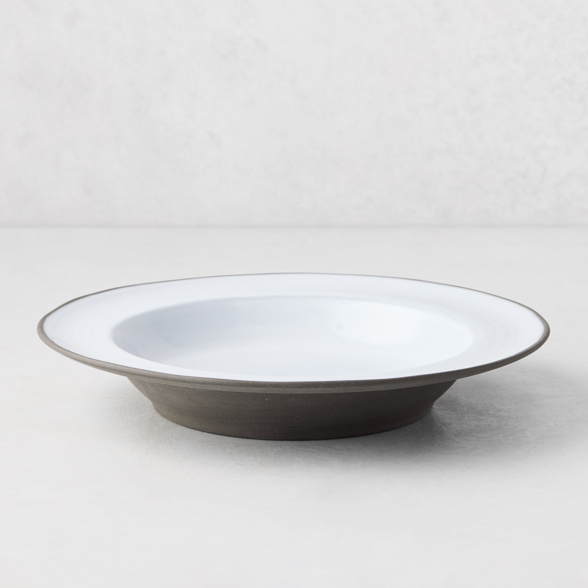Smoke Grey Stoneware Soup Bowl, two-toned with light grey glazed interior and dark grey unglazed exterior.