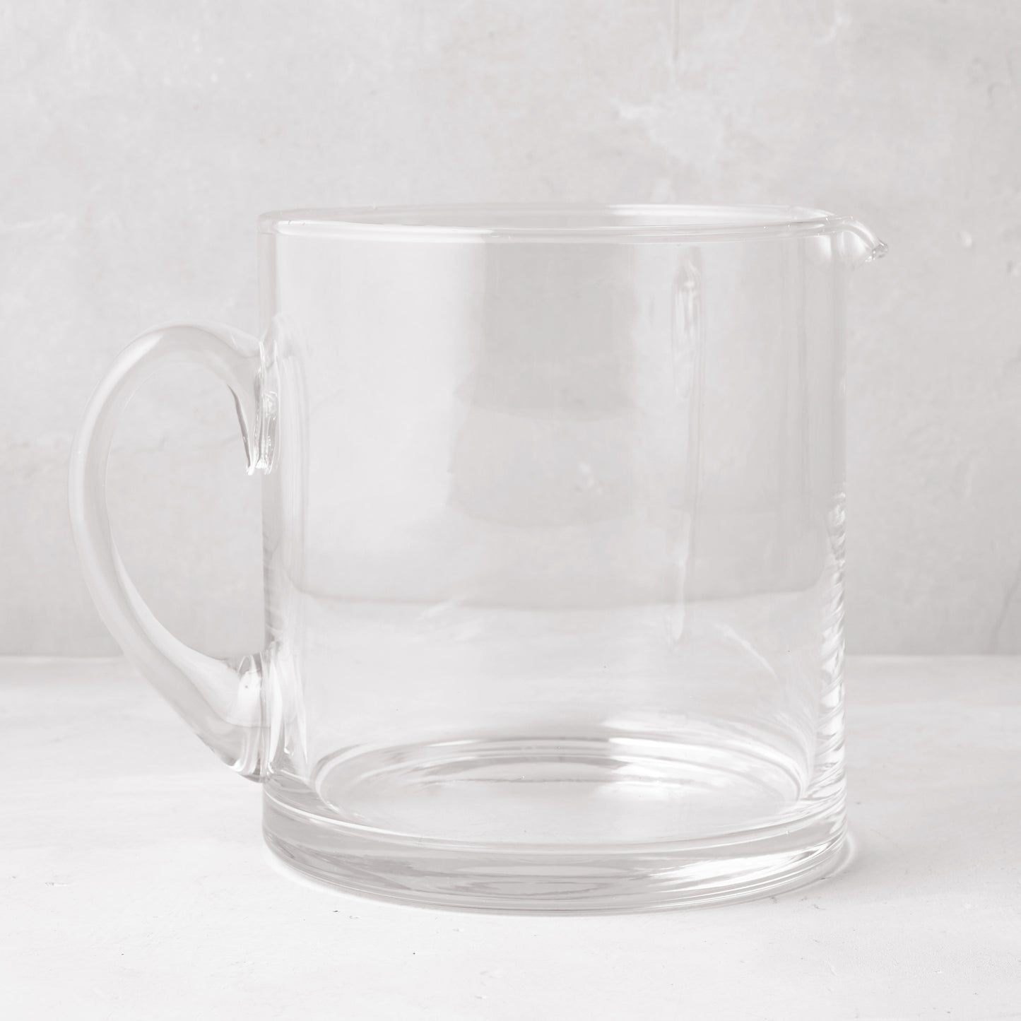 Clear Soho Short Glass Pitcher, wide design with handle and pour spout.