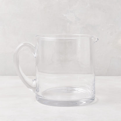 Soho Short Glass Pitcher, clear hand-blown glass, wide design, with handle and pour spout.
