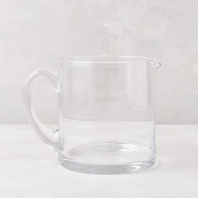 Soho Short Glass Pitcher, clear hand-blown glass, wide design, with handle and pour spout.