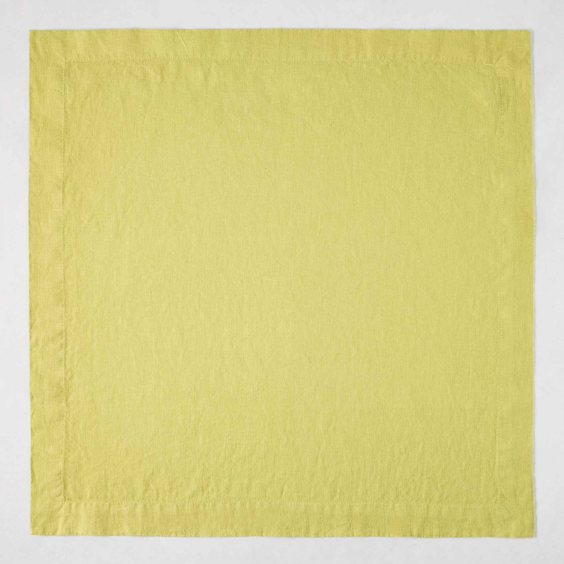 HG Sour Apple hand-dyed 22-inch square linen napkin with mitered corners.