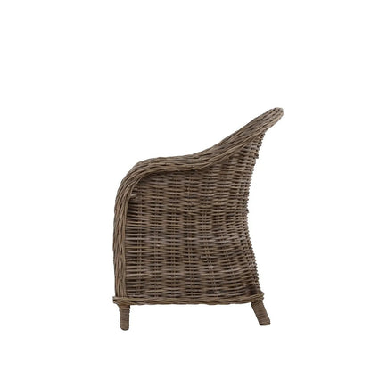 Southern French Arm Chair, natural rattan, woven texture, curved back, side view.