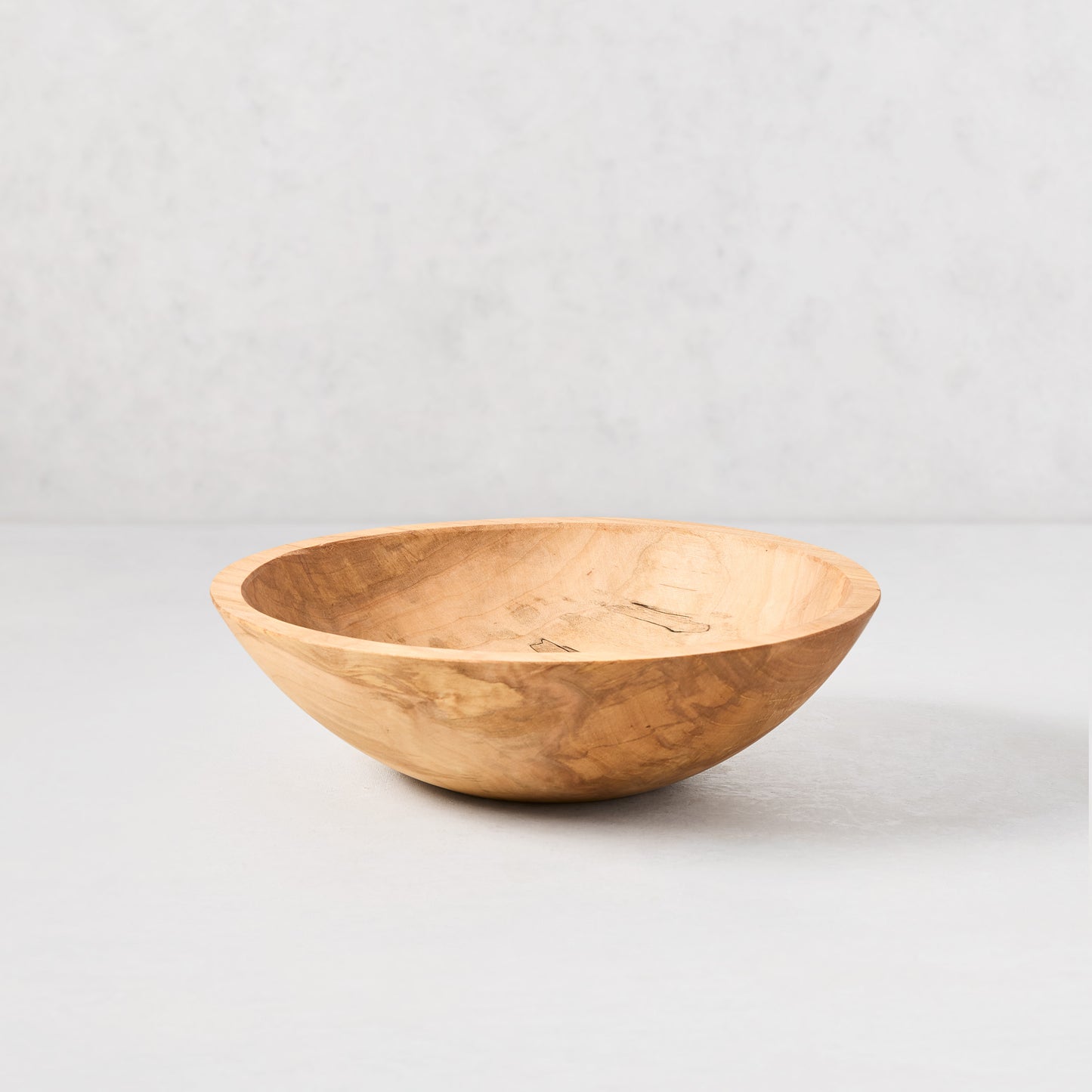 11" spalted maple wood bowl with natural light brown tones and unique dark fungal patterns.