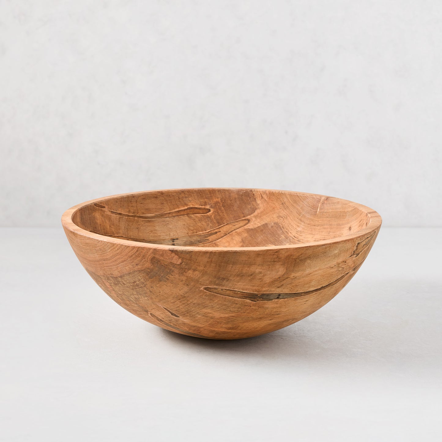 15" spalted maple wood bowl with unique natural patterns and warm brown tones.