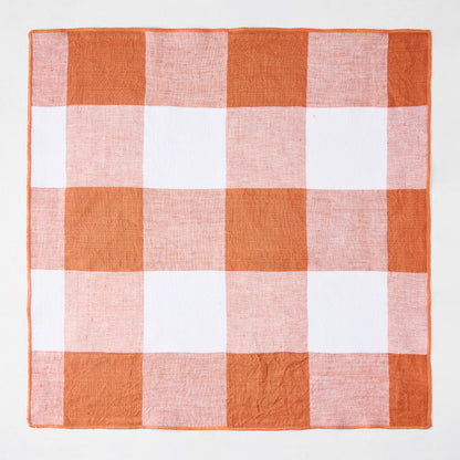 Spice orange and white buffalo check linen-cotton napkin, 20" square.