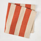 Spice Orange Hampton Stripe Natural Cotton Napkin, folded, with wide orange and khaki stripes.