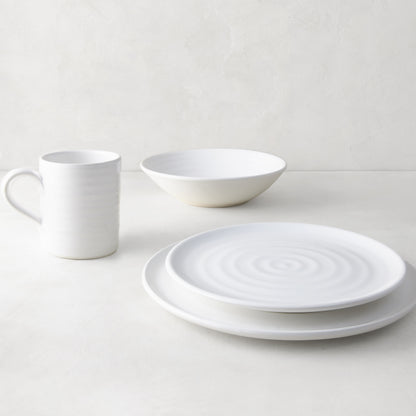 White ceramic dinnerware set: spiral dinner plate, salad plate, bowl, and mug.