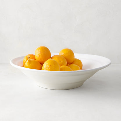 White ceramic Spiral Flared Serve Bowl, 15.5"Dia, filled with lemons and oranges.