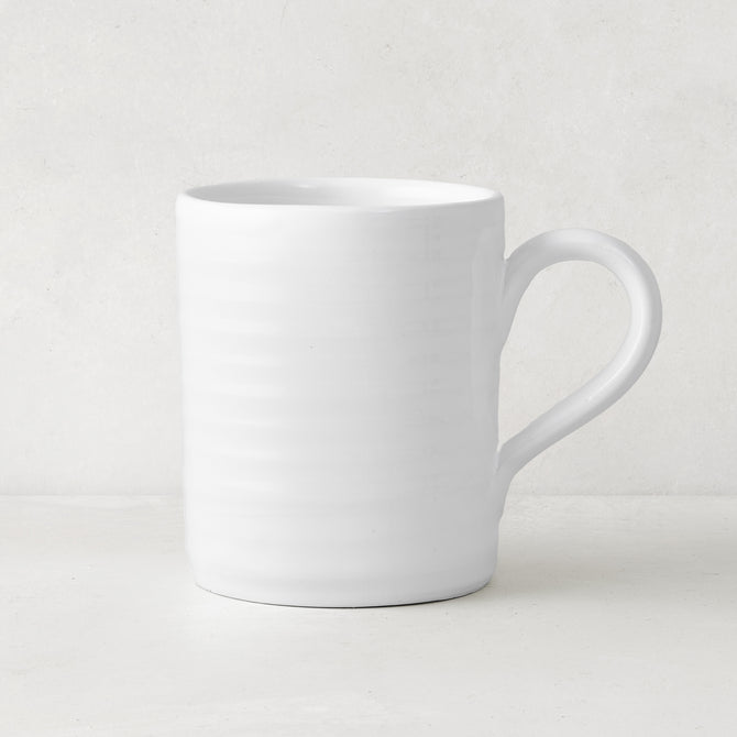 White ceramic Spiral Mug with subtle horizontal ridges and a curved handle.