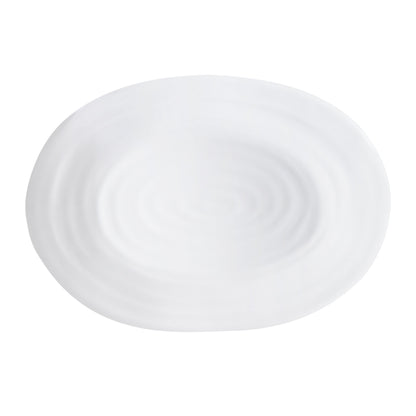 White ceramic oval serving platter with a subtle spiral design and modern coupe edge.