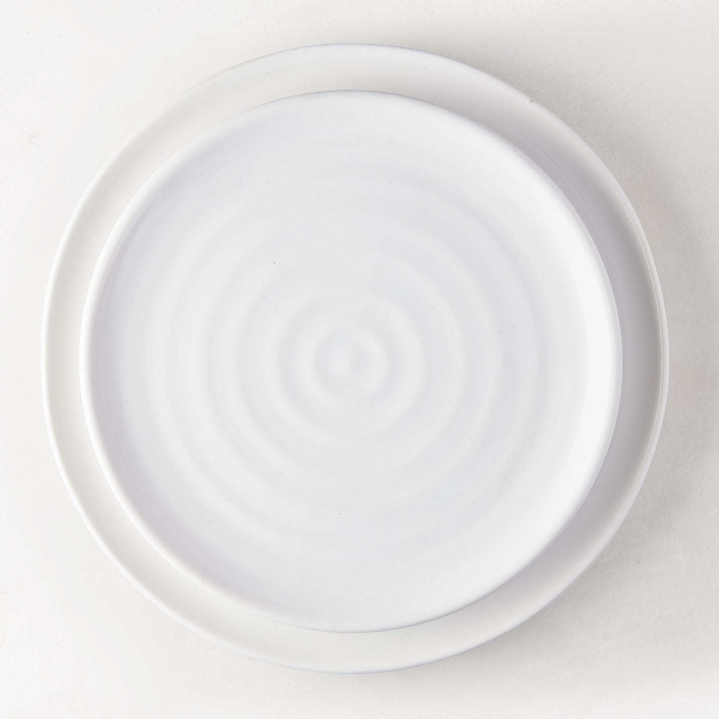 White ceramic spiral salad plate, 9" diameter, handmade in Italy.