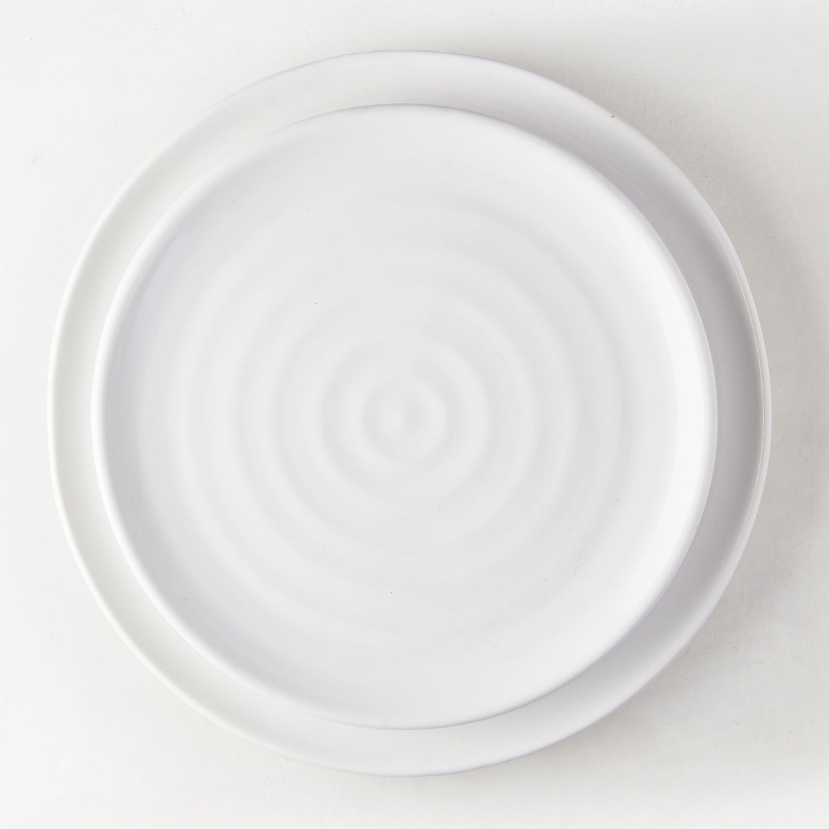 White ceramic spiral salad plate, 9" diameter, handmade in Italy.