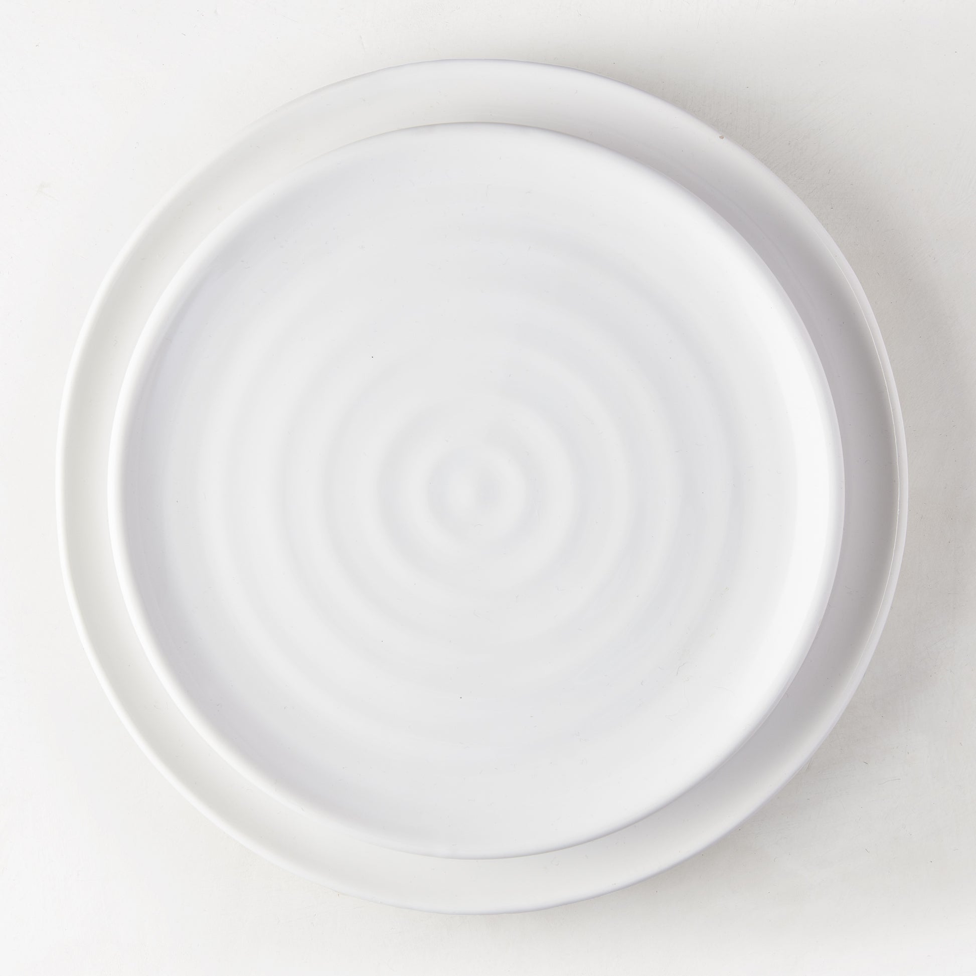 White ceramic spiral salad plate, 9" diameter, handmade in Italy.