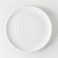 White ceramic spiral salad plate, 9" diameter, handmade in Italy.