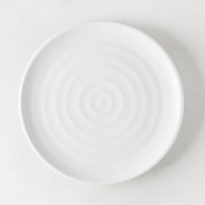 White ceramic spiral salad plate, 9" diameter, handmade in Italy.
