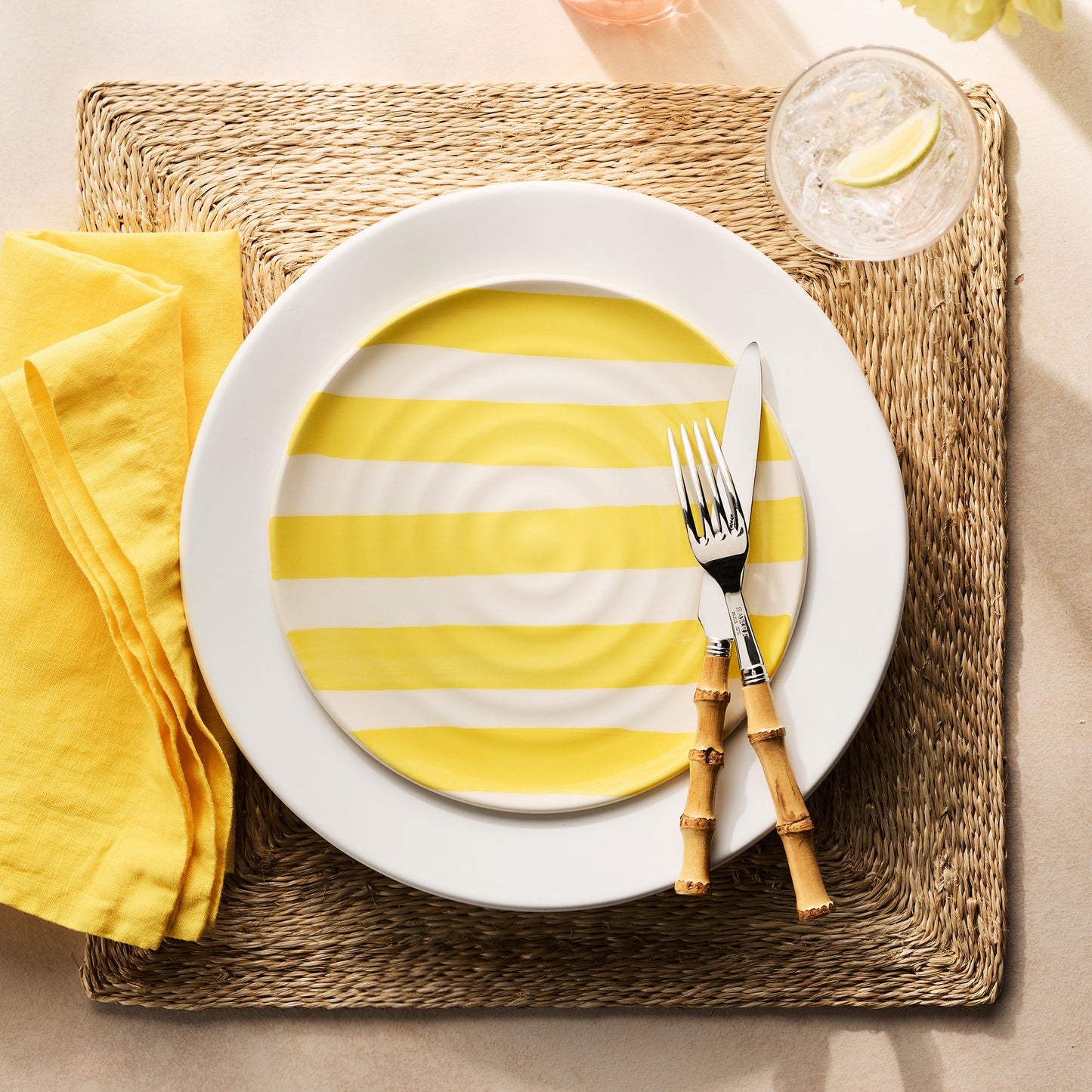 Handmade Italian ceramic salad plate with yellow spiral stripes, 9" diameter.