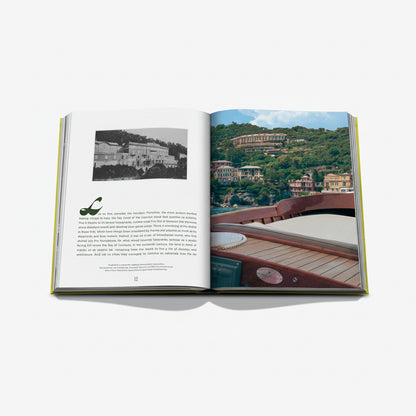 Open hardcover "Splendido" coffee table book with green binding, showing Portofino hotel images and text.