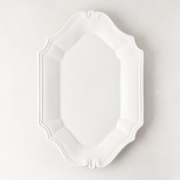Sprezzatura white ceramic serving platter with decorative scalloped edges, 11.8"L x 8.25"W.