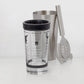 Stainless steel Boston cocktail shaker set with a mixing glass featuring printed recipes and a black rubber rim.