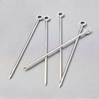 Set of six silver stainless steel cocktail picks, 3.75"L, with a ring top design.