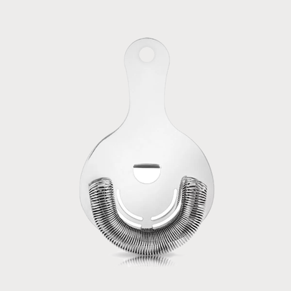 Silver stainless steel Hawthorne cocktail strainer with a tight spring coil and finger rest.