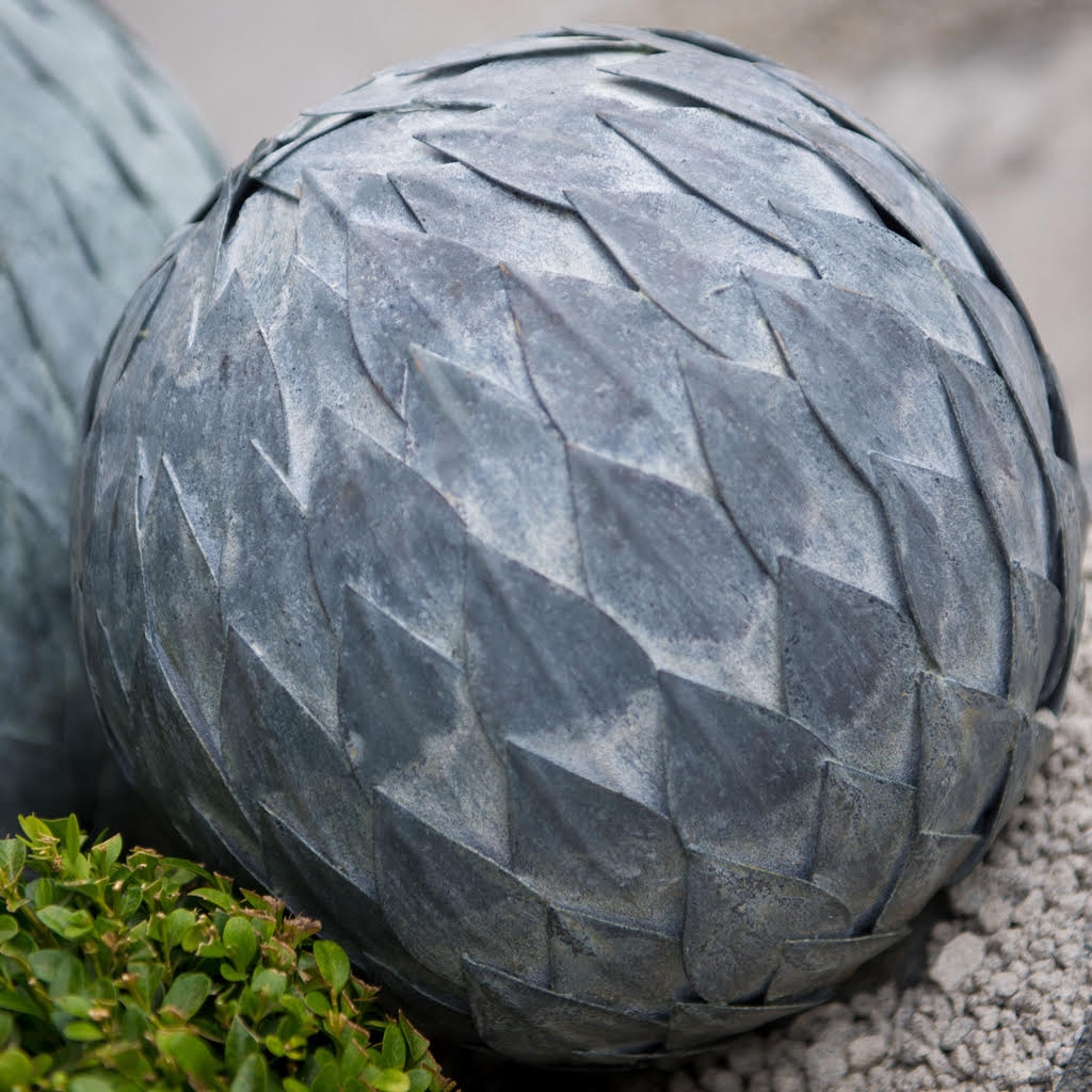 Steel Metal Garden Leaf Ball, spherical sculpture with layered, hand-welded metal leaves, weathered gray finish.