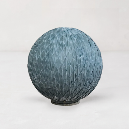 Steel Metal Garden Leaf Ball, dark gray, made from layered, hand-welded leaves.