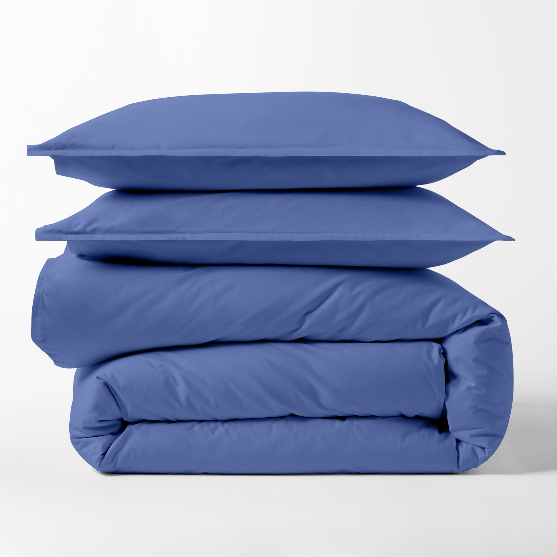 Steele Blue Italian Percale Duvet Set, folded, with two stacked shams.