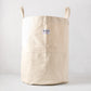 Steele natural-toned canvas storage bin with two handles and a brand label.