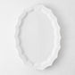 Stella white ceramic oval serving platter with a decorative scalloped edge, 17.3 by 12.8 inches.