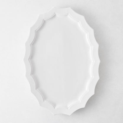 Stella white ceramic oval serving platter with a decorative scalloped edge, 17.3 by 12.8 inches.