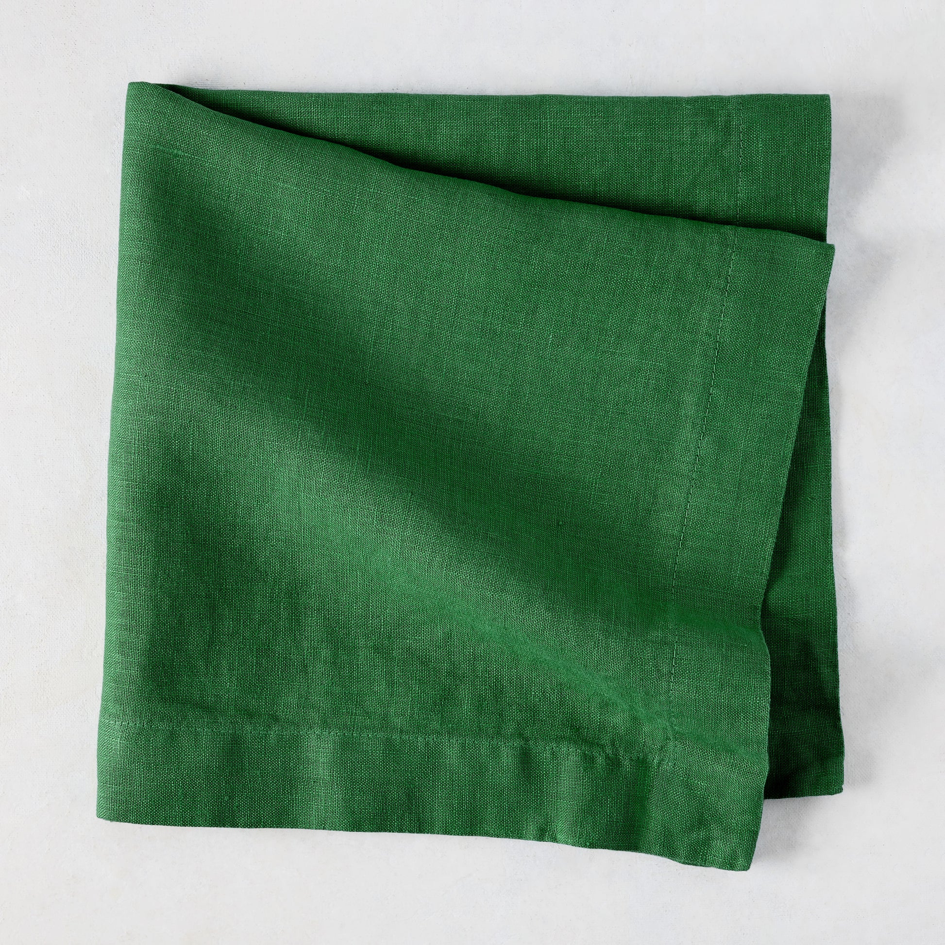 Stem HG Signature hand-dyed Kelly Green linen napkin, 22-inch square, folded.