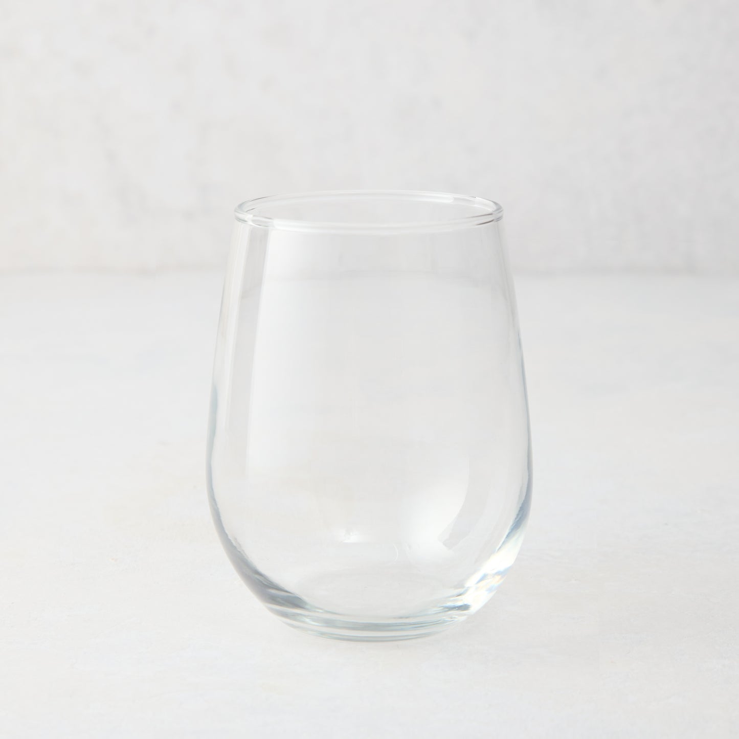 Clear glass stemless all-purpose wine glass, 16.75 oz, from Hudson Grace collection.