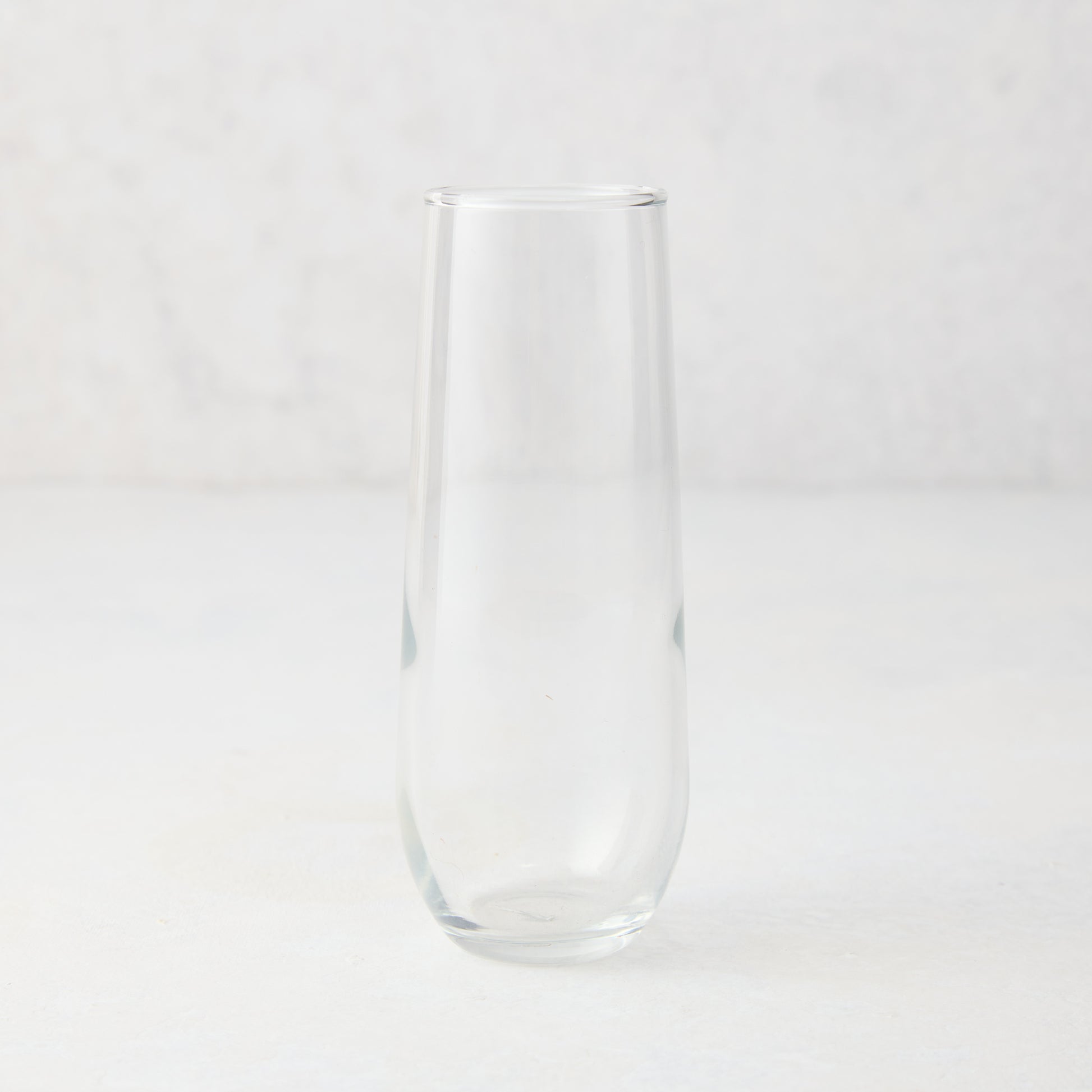 Clear glass Hudson Grace Stemless Champagne Flute, 8.5 oz, on a white background.