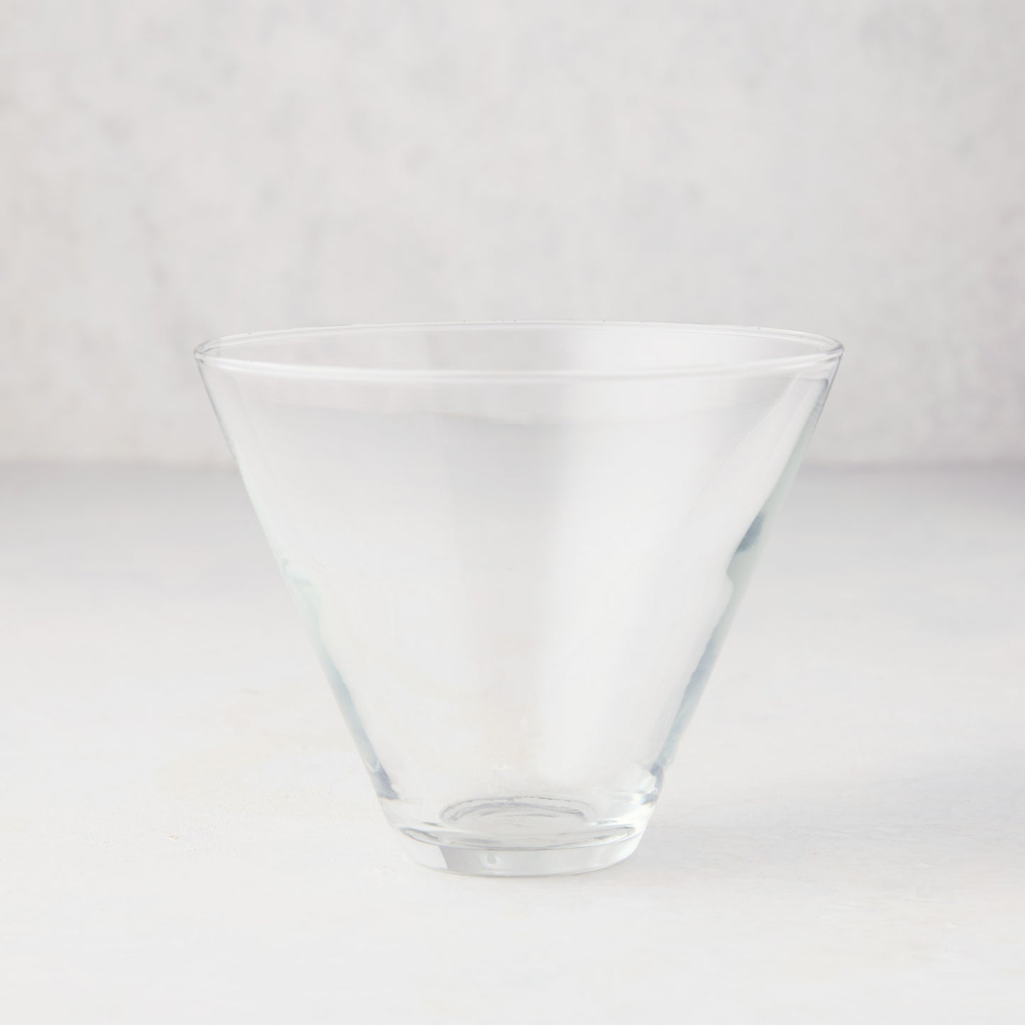 Hudson Grace Stemless Martini Glass, clear glass, conical top, wide brim, 8 oz. capacity.