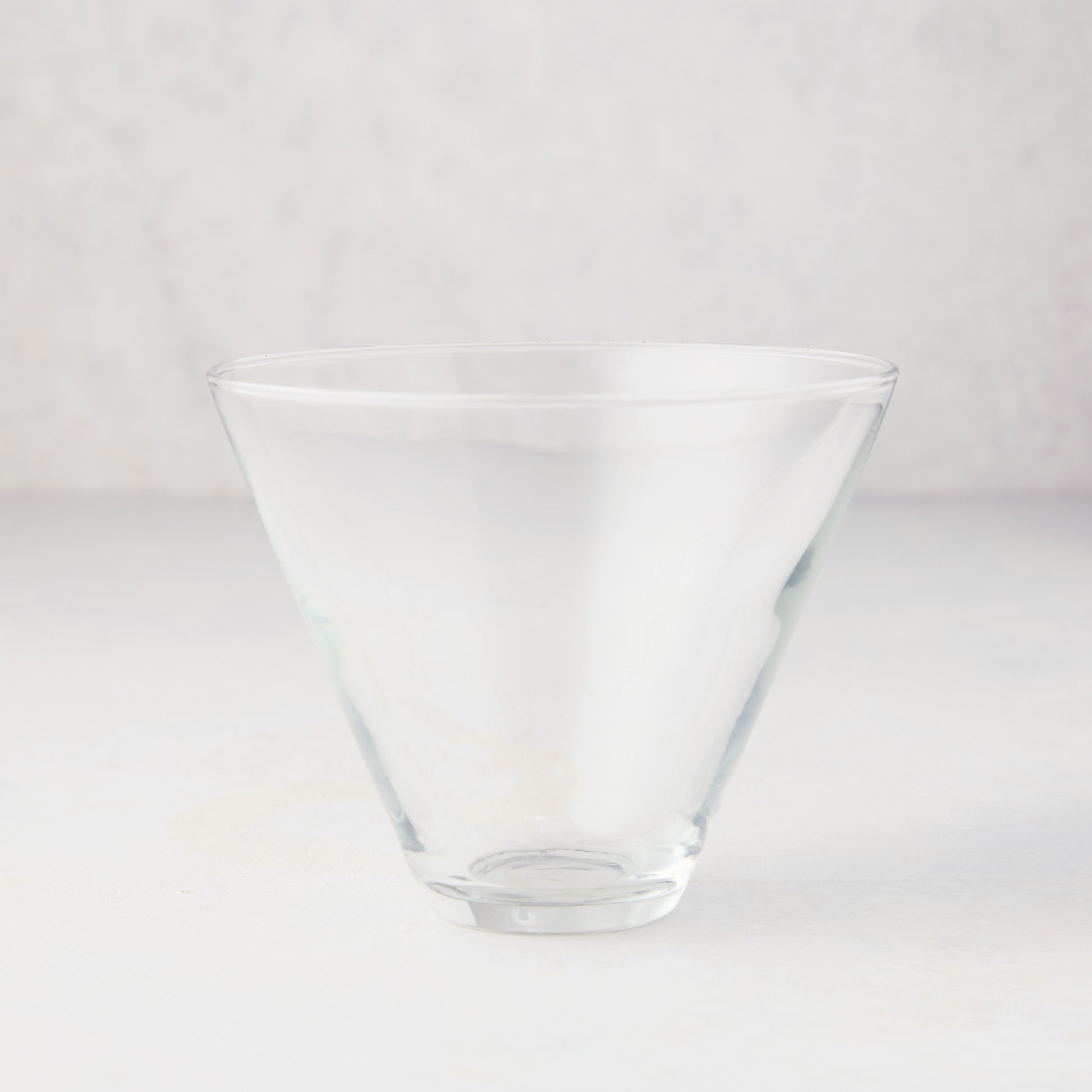 Hudson Grace Stemless Martini Glass, clear glass, conical top, wide brim, 8 oz. capacity.