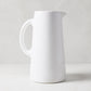 Large Stinson white ceramic pitcher with handle and spout, handmade in Italy.