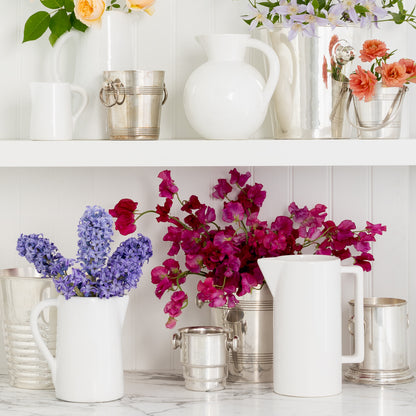 White ceramic Stinson pitcher with large handle and spout, handmade in Italy.