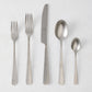 Stoccolma Pewter 5-piece flatware set with brushed 18/10 stainless steel finish, including two forks, knife, and two spoons.