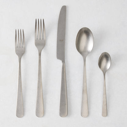 Stoccolma Pewter 5-piece flatware set with brushed 18/10 stainless steel finish, including two forks, knife, and two spoons.