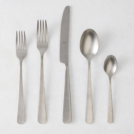 Stoccolma Pewter 5-piece flatware set with brushed 18/10 stainless steel finish, including two forks, knife, and two spoons.