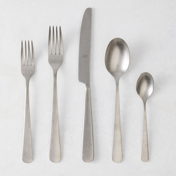 Stoccolma Pewter 5-piece flatware set with brushed 18/10 stainless steel finish, including two forks, knife, and two spoons.