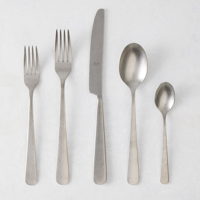 Stoccolma Pewter 5-piece flatware set with brushed 18/10 stainless steel finish, including two forks, knife, and two spoons.