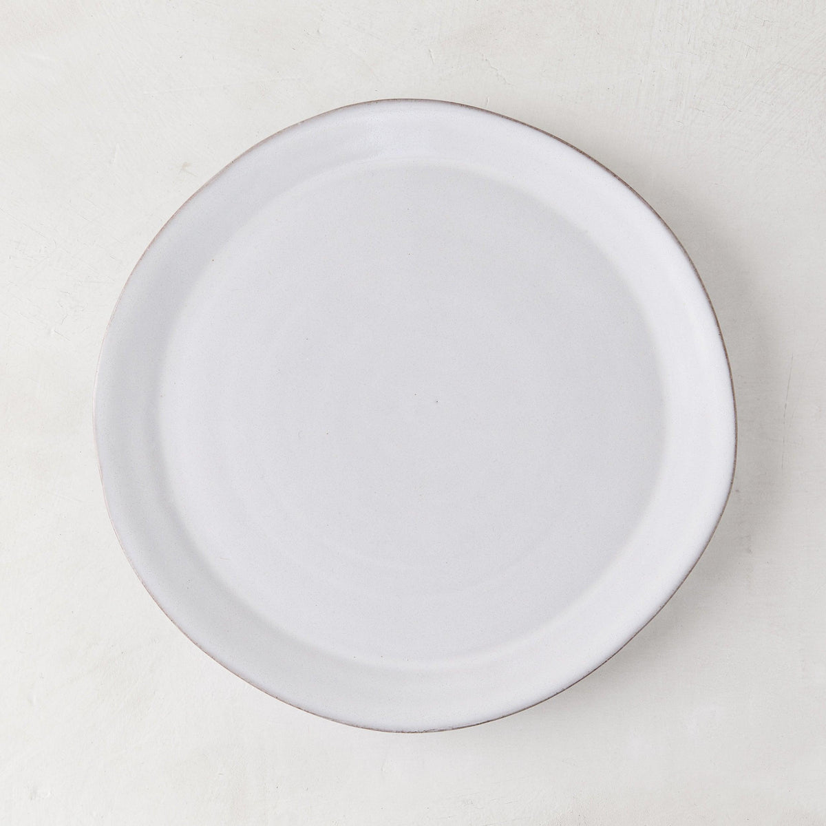 Stone Grey Salad Plate, 8.25" diameter, hand-glazed terracotta with a cool grey-white hue.