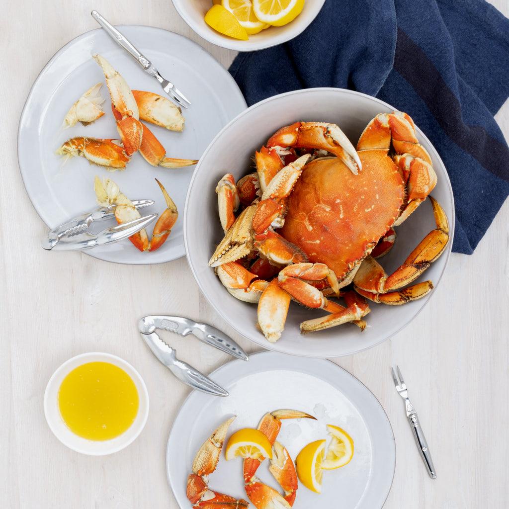 Stone grey stoneware serve bowl, 10.25" diameter, filled with crab, on a light wood table.