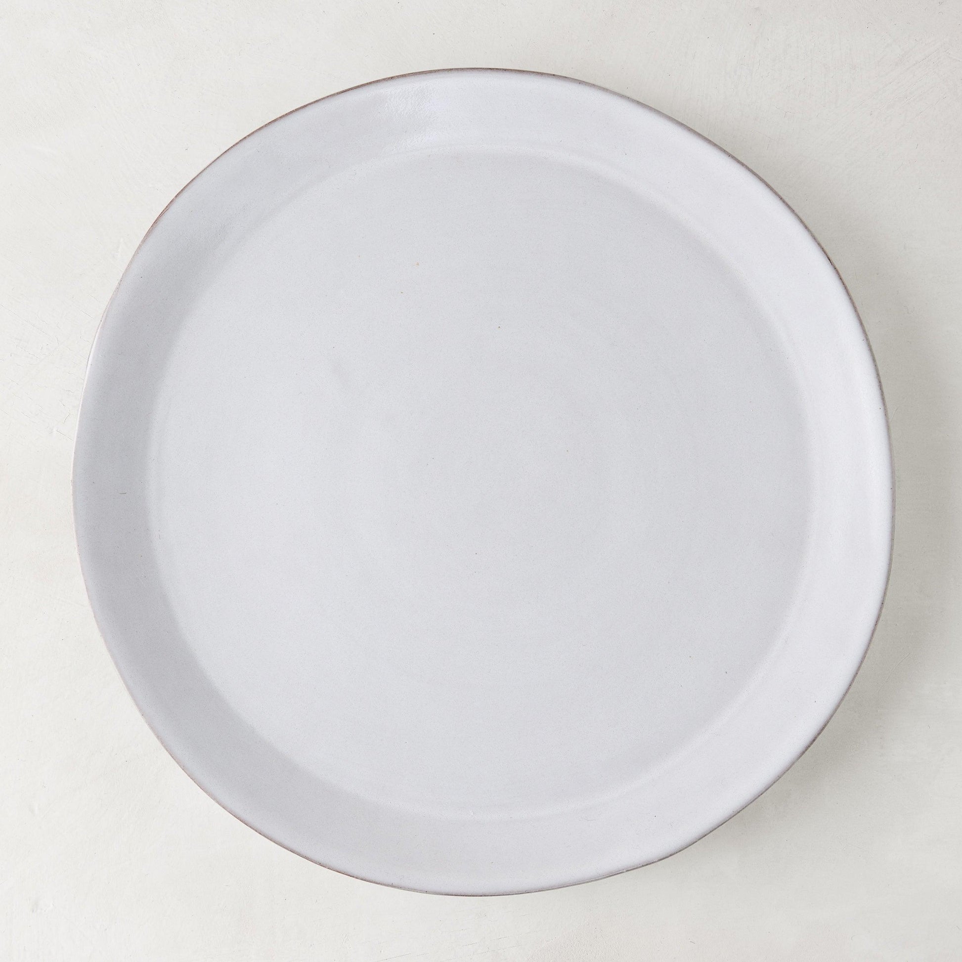 Stone Grey Dinner Plate, 10.75" diameter, hand-glazed terracotta in a cool grey-white hue.