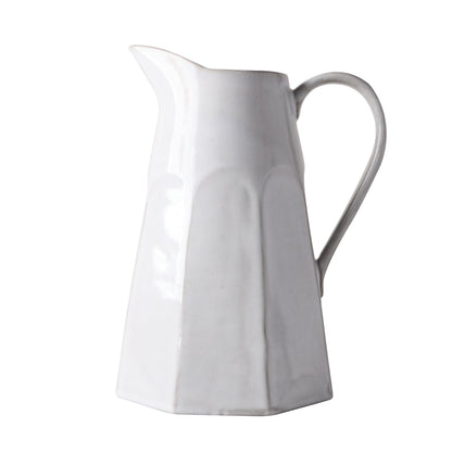 Stone grey hand-glazed terracotta pitcher with a textured finish and faceted design.