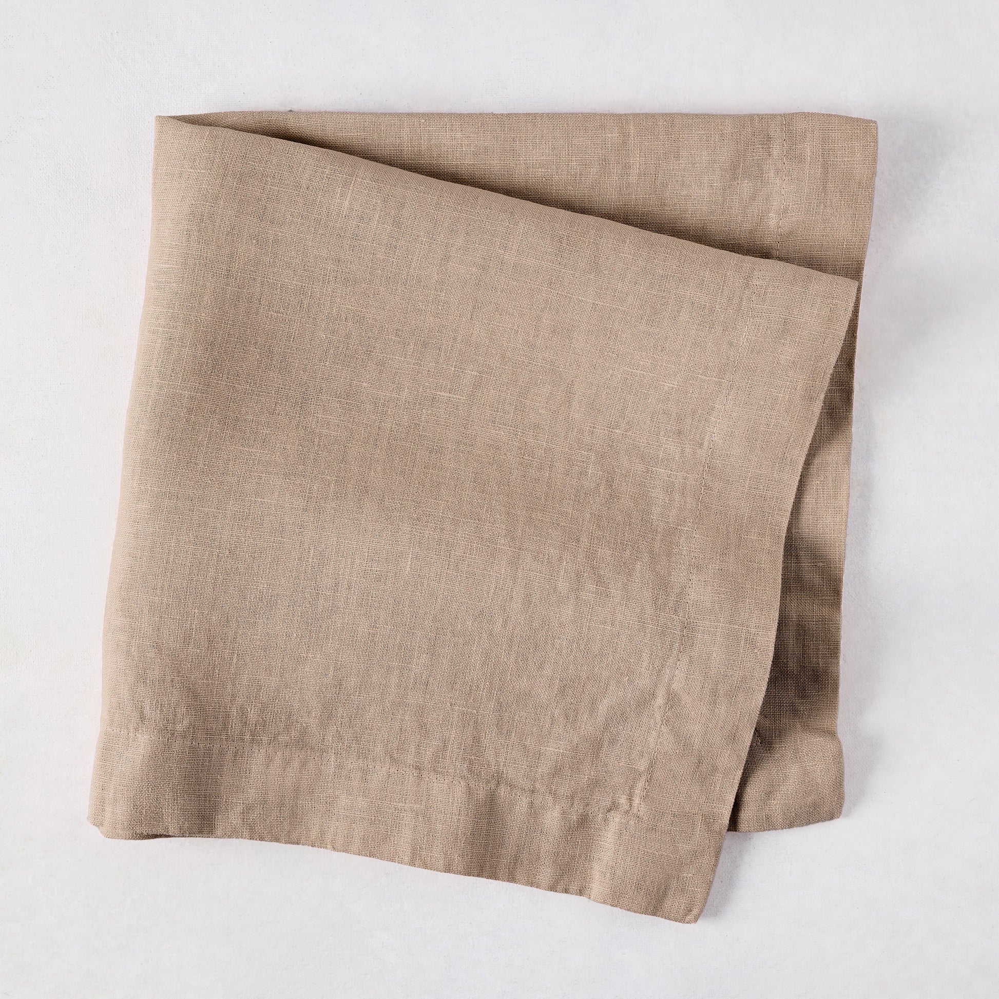 Stonewall Khaki HG Signature Hand-dyed Linen Napkin, 22-inch square, folded.