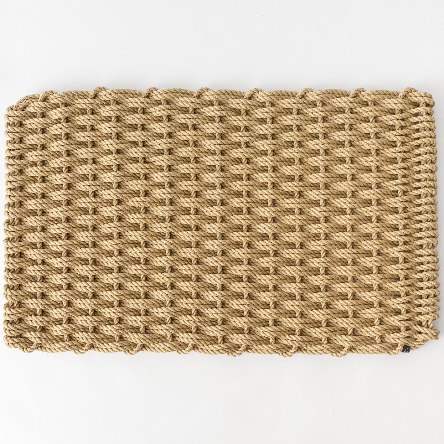 Straw braided rope doormat, handwoven, natural tan color, rectangular shape.