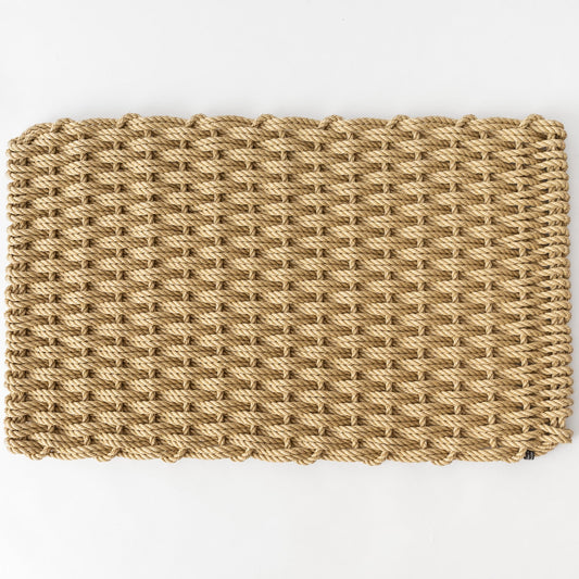 Straw braided rope doormat, handwoven, natural tan color, rectangular shape.